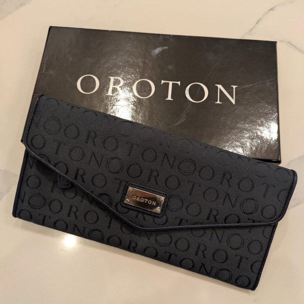 New Oroton Navy Stencil Travel Wallet in original box with tags